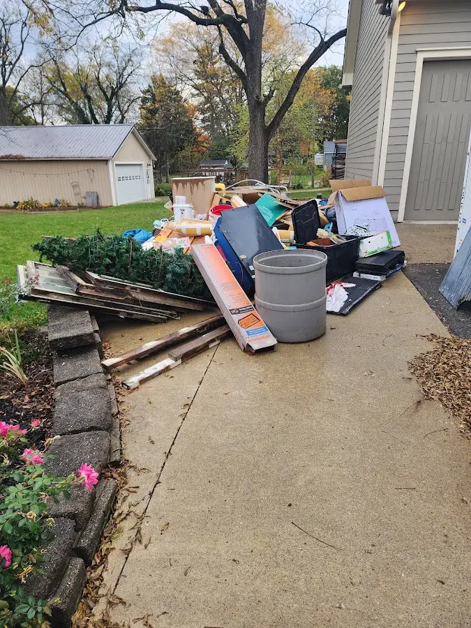 Dumpster being loaded with debris for 3 Yard Dumpster Rental in Perrysburg